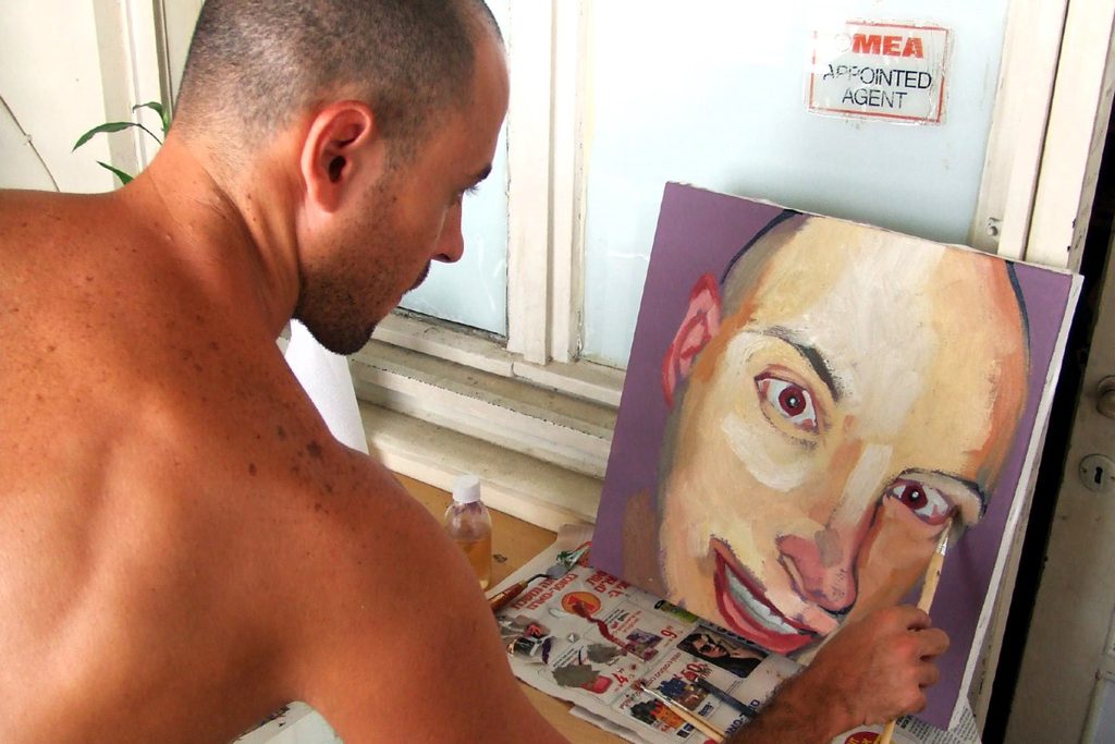 Roi Pajursky artist in studio working on a contemporary portrait painting, expressionist style from The Living Canvas series.
